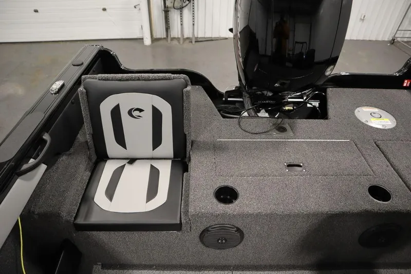 Slide: The Image of 2025 Crestliner 1850 Super Hawk JS boat interior with seating and motor. - 35