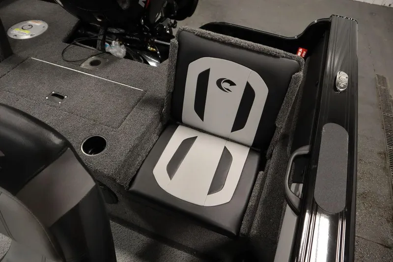 Slide: The Image of 2025 Crestliner 1850 Super Hawk JS boat interior with cushioned seating and storage. - 36