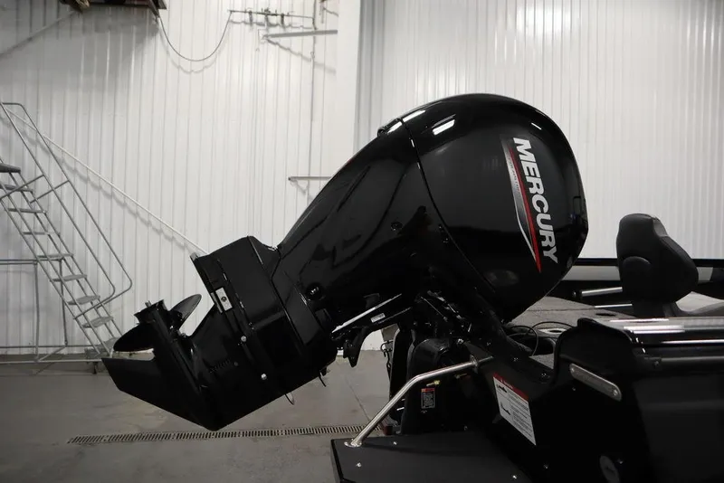 Slide: The Image of 2025 Crestliner 1850 Super Hawk JS with Mercury outboard motor in a garage. - 39