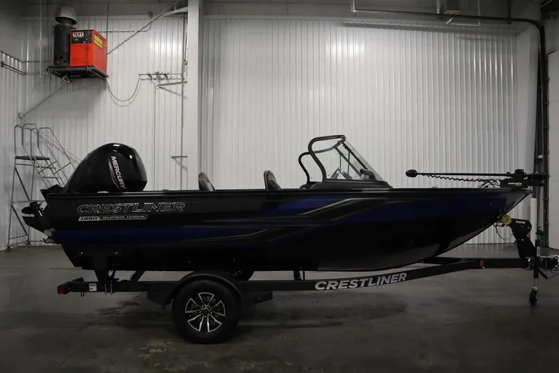 Slide: The Image of 2025 Crestliner 1850 Super Hawk JS boat in a garage setting. - 4