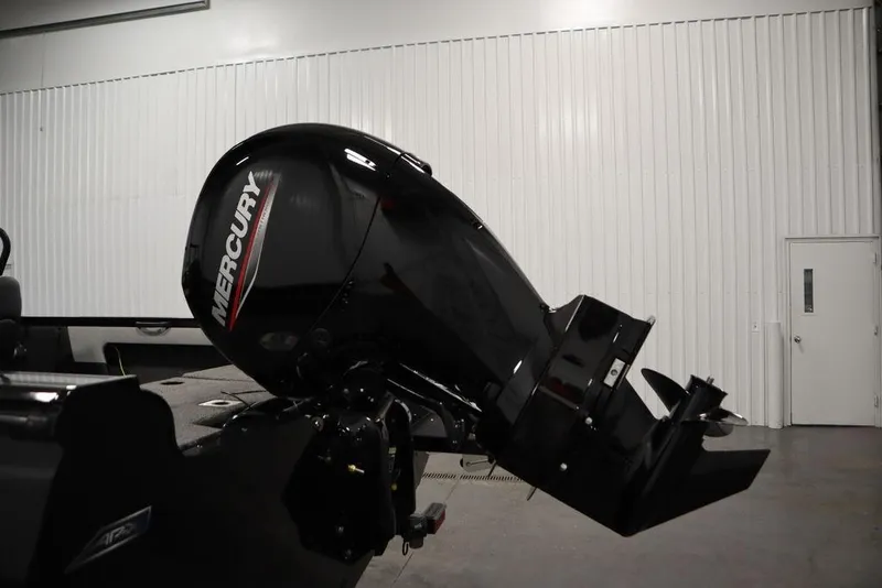 Slide: The Image of 2025 Crestliner 1850 Super Hawk JS with Mercury outboard motor in a showroom. - 40