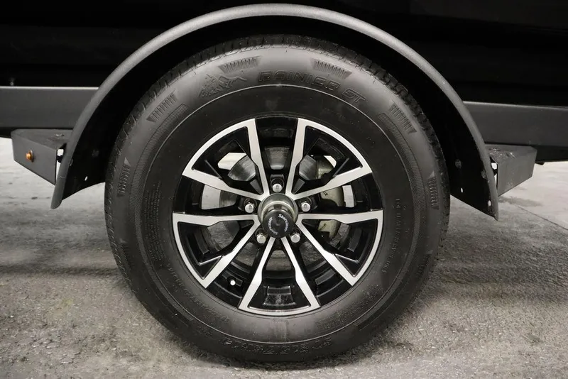 Slide: The Image of 2025 Crestliner 1850 Super Hawk JS trailer wheel, black and silver design. - 44