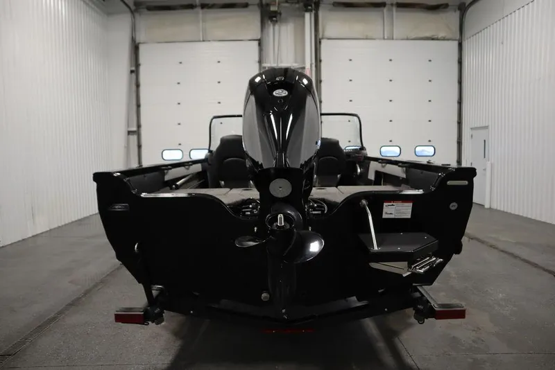 Slide: The Image of 2025 Crestliner 1850 Super Hawk JS boat in a garage, rear view. - 6