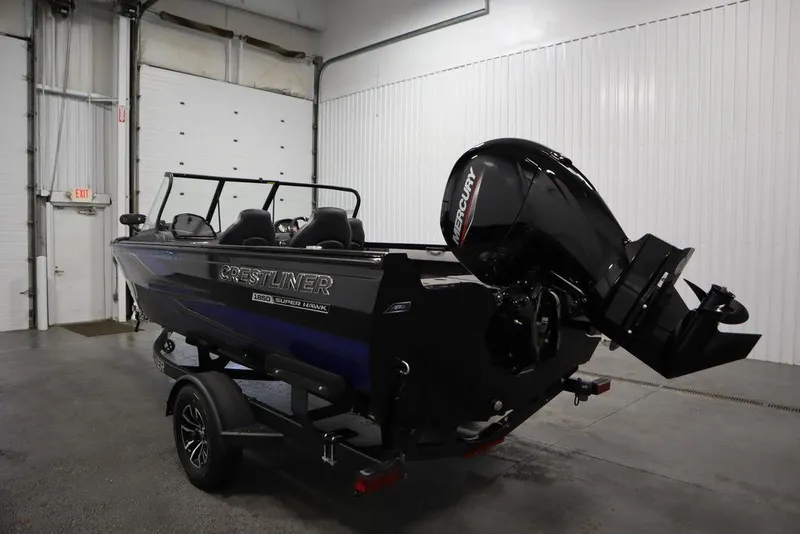 Slide: The Image of 2025 Crestliner 1850 Super Hawk JS boat in a garage setting. - 7