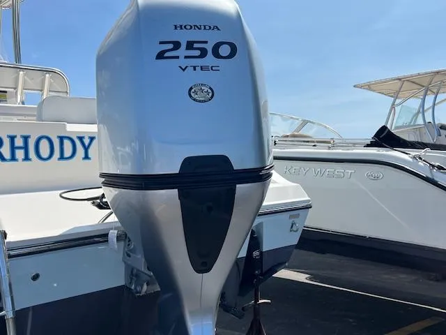 Slide: The Image of 2021 Cobia 237 Center Console with Honda 250 VTEC outboard engine. - 4