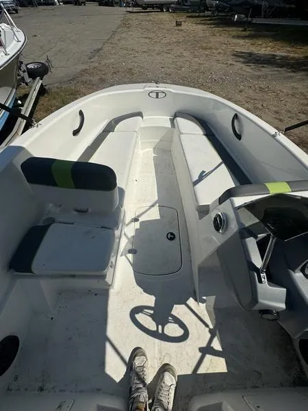 Slide: The Image of 2022 Tahoe T16 boat interior with seating and steering wheel. - 7