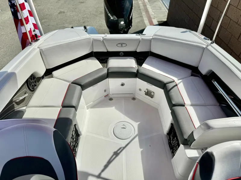Slide: The Image of 2022 Tahoe 210 S boat interior with white and black seating. - 16