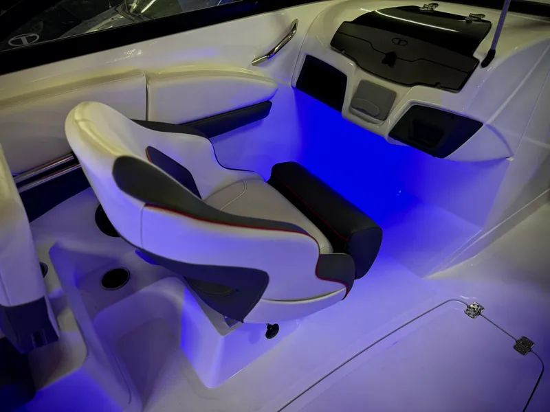 Slide: The Image of 2022 Tahoe 210 S boat interior with illuminated seating and modern design. - 23