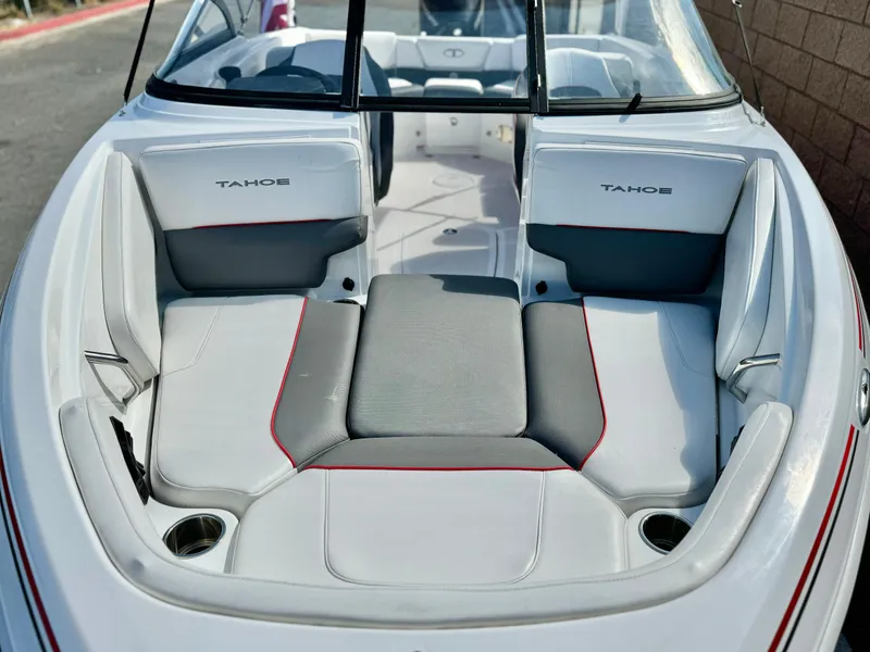 Slide: The Image of 2022 Tahoe 210 S boat interior with white and gray seating. - 8