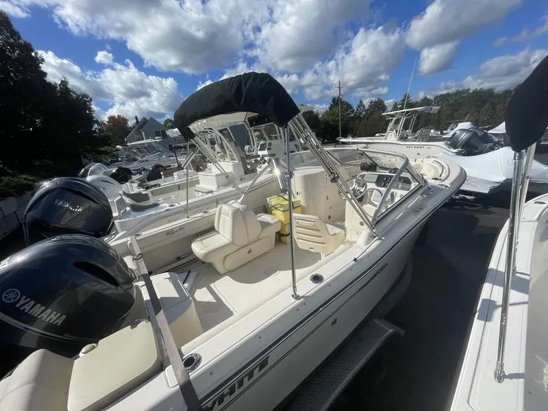 Slide: The Image of 2017 Grady-White 205 Freedom boat with Yamaha engines, docked under a blue sky. - 11