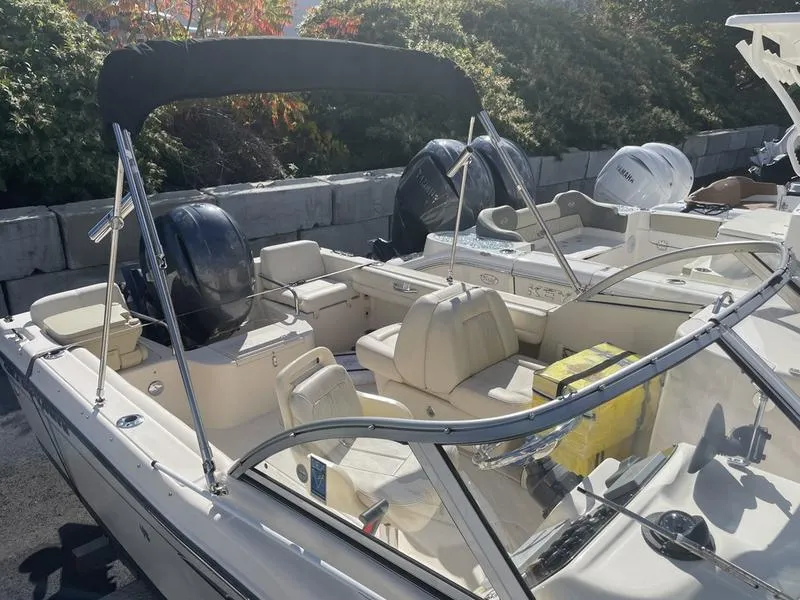 Slide: The Image of 2017 Grady-White 205 Freedom boat with dual engines and seating, docked outdoors. - 4