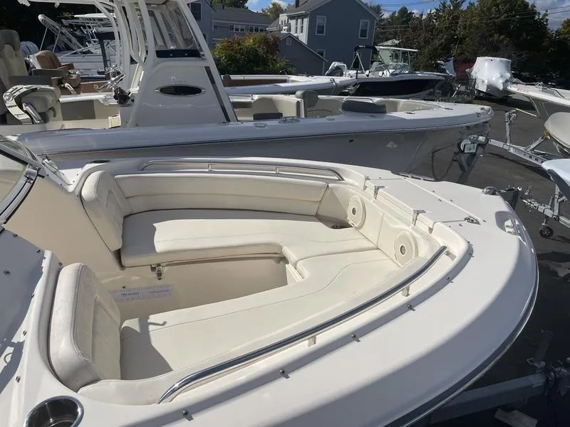Slide: The Image of 2017 Grady-White 205 Freedom boat with spacious seating, docked outdoors. - 5