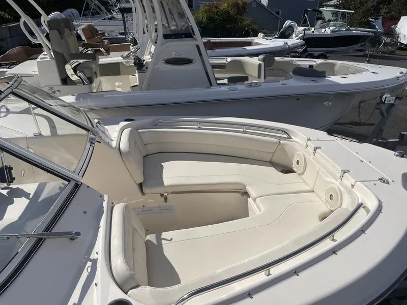 Slide: The Image of 2017 Grady-White 205 Freedom boat with spacious seating in a marina setting. - 6