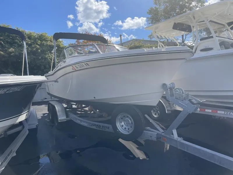 Slide: The Image of 2017 Grady-White 205 Freedom boat on trailer under blue sky. - 8