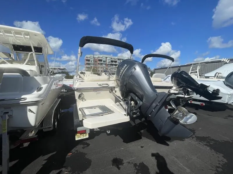 Slide: The Image of 2017 Grady-White 205 Freedom boat with Yamaha outboard motor, parked under blue sky. - 9