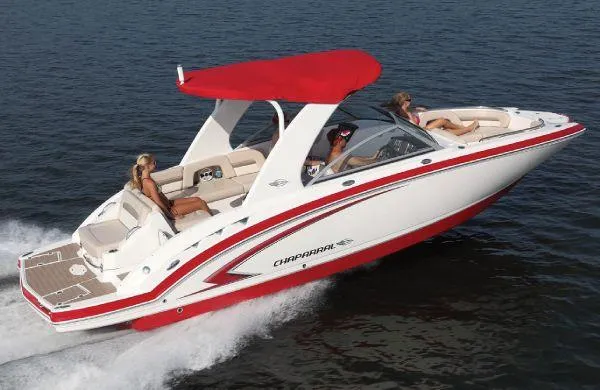 Slide: The Image of 2012 Chaparral 264 Sunesta boat cruising on water with red canopy. - 13