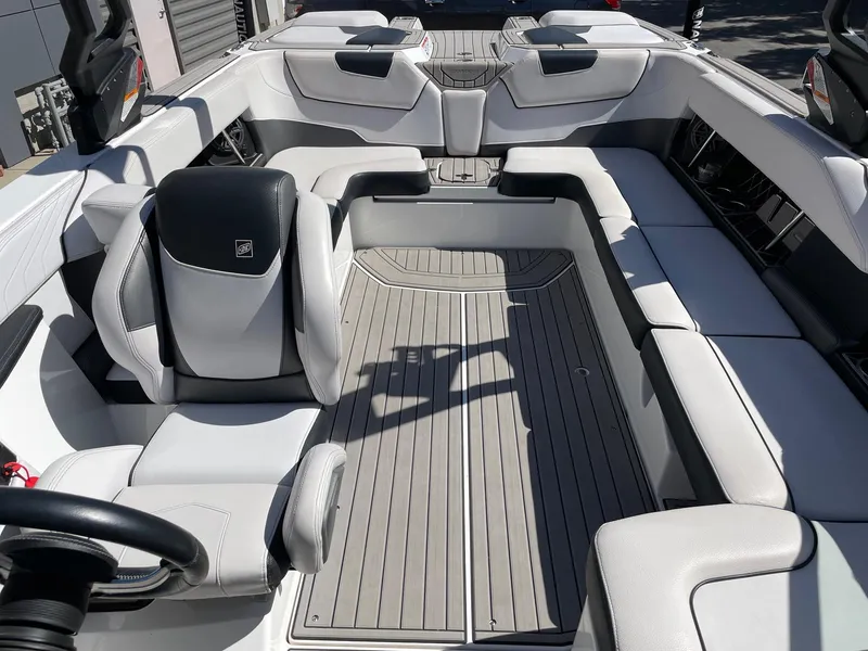 Slide: The Image of 2019 Nautique Super Air Nautique GS24 interior with sleek seating and modern design. - 12