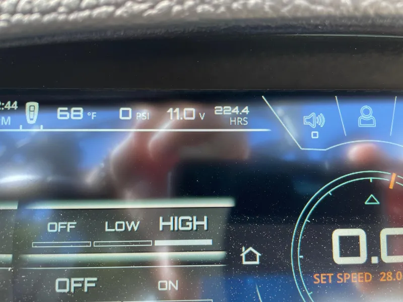 Slide: The Image of Dashboard display of 2019 Nautique Super Air Nautique GS24 boat, showing temperature and voltage. - 13