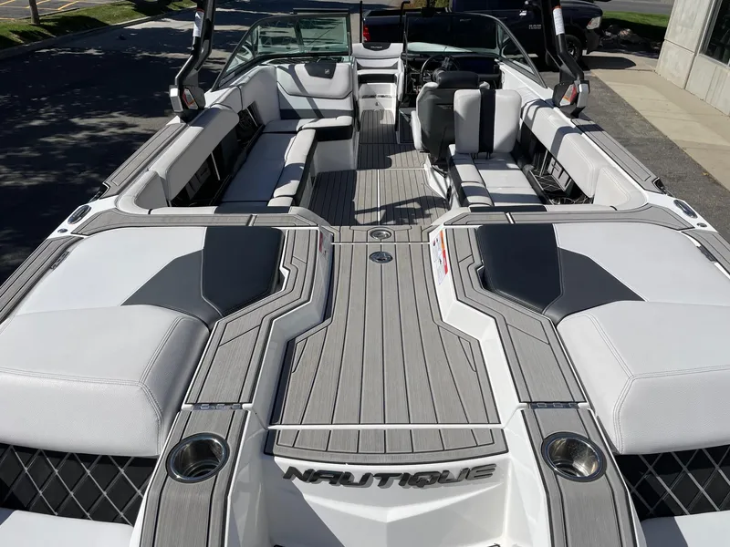 Slide: The Image of 2019 Nautique Super Air Nautique GS24 boat interior with sleek seating and modern design. - 4
