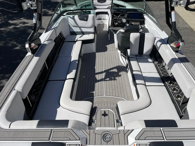 Slide: The Image of 2019 Nautique Super Air Nautique GS24 interior with sleek seating and modern dashboard. - 5