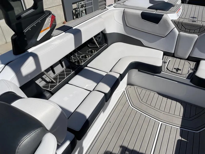 Slide: The Image of 2019 Nautique Super Air Nautique GS24 interior with sleek seating and modern design. - 7