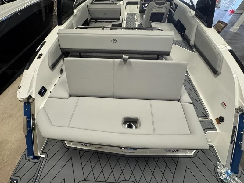 Slide: The Image of 2025 Cobalt R6 boat interior with gray seating and modern design. - 11