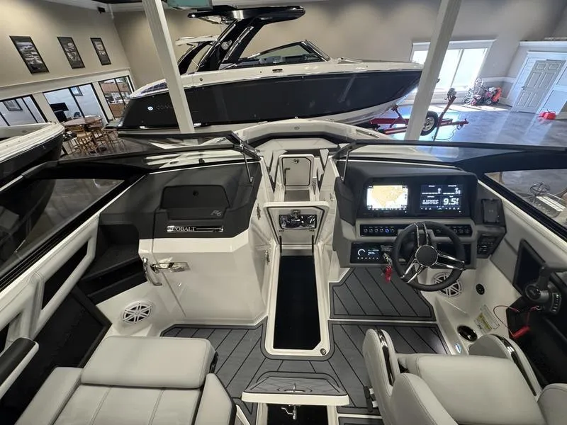 Slide: The Image of Interior view of 2025 Cobalt R6 boat with modern dashboard and seating. - 12