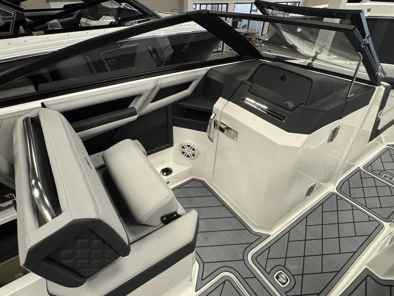 Slide: The Image of 2025 Cobalt R6 boat interior with sleek seating and modern dashboard design. - 15