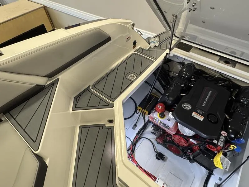 Slide: The Image of 2025 Cobalt R6 boat engine compartment with sleek seating and modern design. - 16