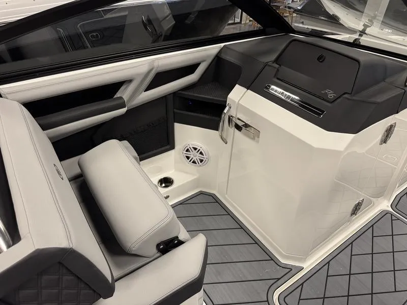 Slide: The Image of 2025 Cobalt R6 boat interior with modern seating and sleek dashboard design. - 19