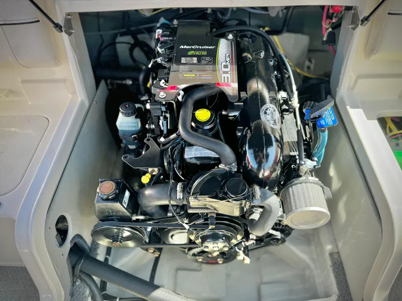 Slide: The Image of 2013 Bayliner 185 Bowrider engine compartment with MerCruiser 3.0L engine. - 13
