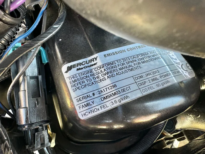 Slide: The Image of Mercury engine emission control label on 2013 Bayliner 185 Bowrider. - 14
