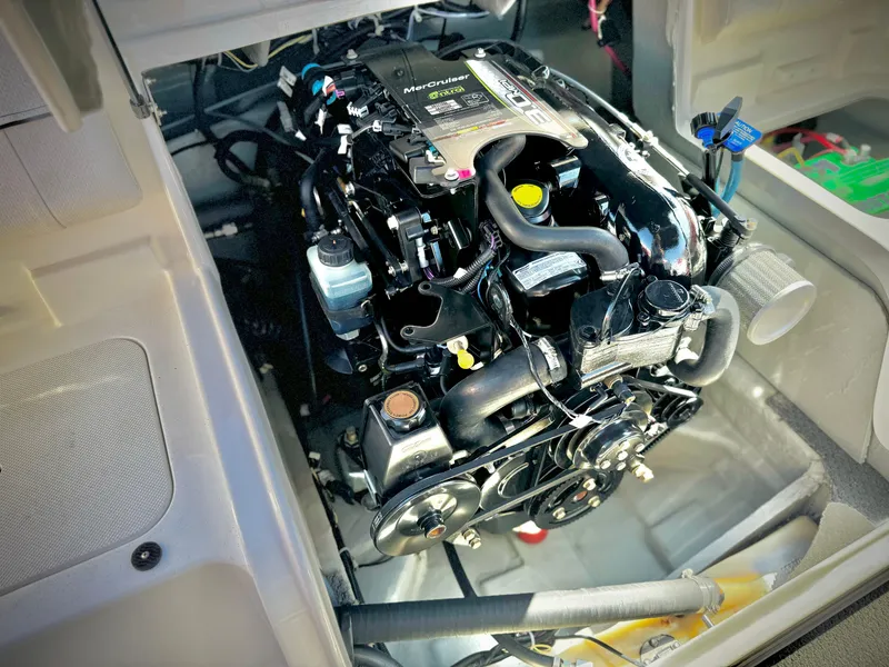 Slide: The Image of 2013 Bayliner 185 Bowrider engine compartment with MerCruiser engine. - 16
