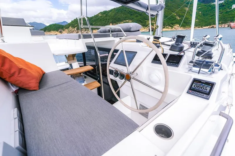 Slide: The Image of 2025 Fountaine Pajot Tanna 47 yacht cockpit with modern navigation equipment and comfortable seating. - 12