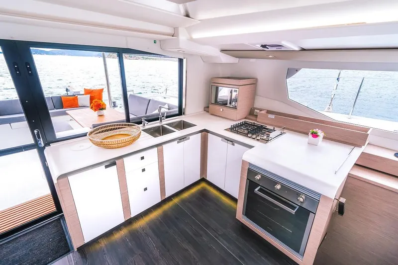 Slide: The Image of Modern kitchen interior of 2025 Fountaine Pajot Tanna 47 yacht with sleek design and ocean view. - 19