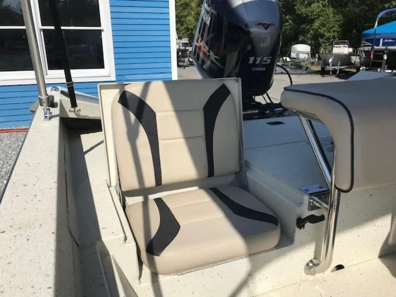 Slide: The Image of 2017 Alumacraft 2072 Bay boat with beige seating and Yamaha 115 outboard motor. - 7