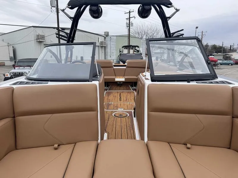Slide: The Image of 2025 Moomba Tykon boat interior with tan seating and sleek design. - 14