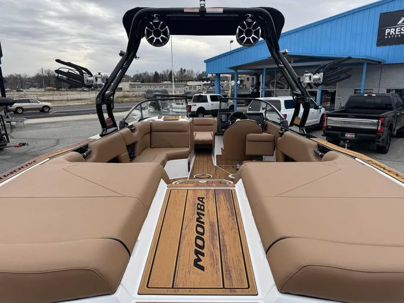 Slide: The Image of 2025 Moomba Tykon boat interior with tan seating and sleek design. - 7