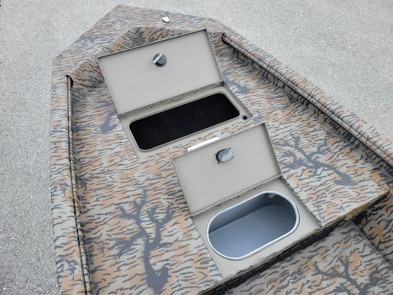 Slide: The Image of 2025 Xpress HD16DB duck hunting boat with camo design and storage compartments. - 5