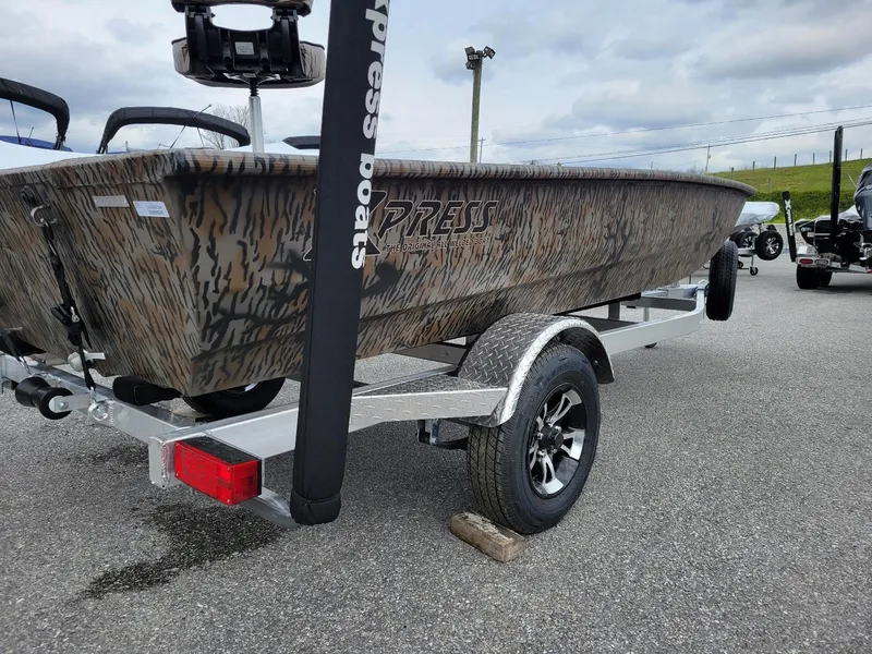 Slide: The Image of 2025 Xpress HD16DB duck hunting boat with Yamaha 25 hp engine on trailer. - 9