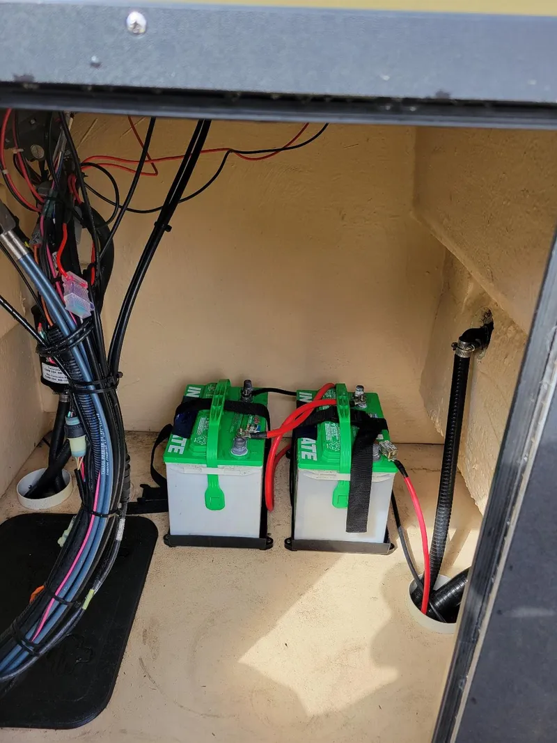 Slide: The Image of Battery compartment of 2021 KenCraft Duck Rider 2060 skiff with wiring and dual batteries. - 10