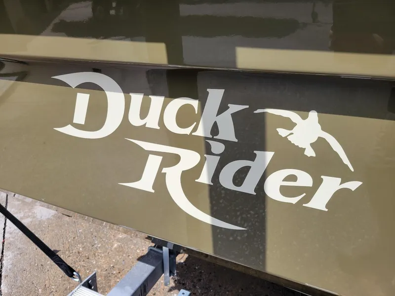 Slide: The Image of KenCraft Duck Rider 2060 logo on boat hull, 2021 model, featuring a flying duck graphic. - 11
