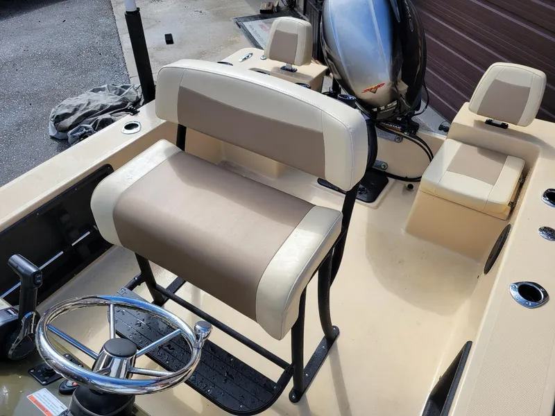 Slide: The Image of 2021 KenCraft Duck Rider 2060 skiff interior with Yamaha 115 engine, center console, and seating. - 17