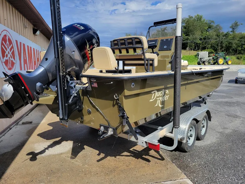 Slide: The Image of 2021 KenCraft Duck Rider 2060 skiff with Yamaha 115 engine on trailer. - 2