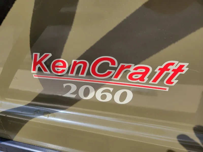 Slide: The Image of KenCraft 2060 logo on a 2021 Duck Rider 20' skiff. - 6