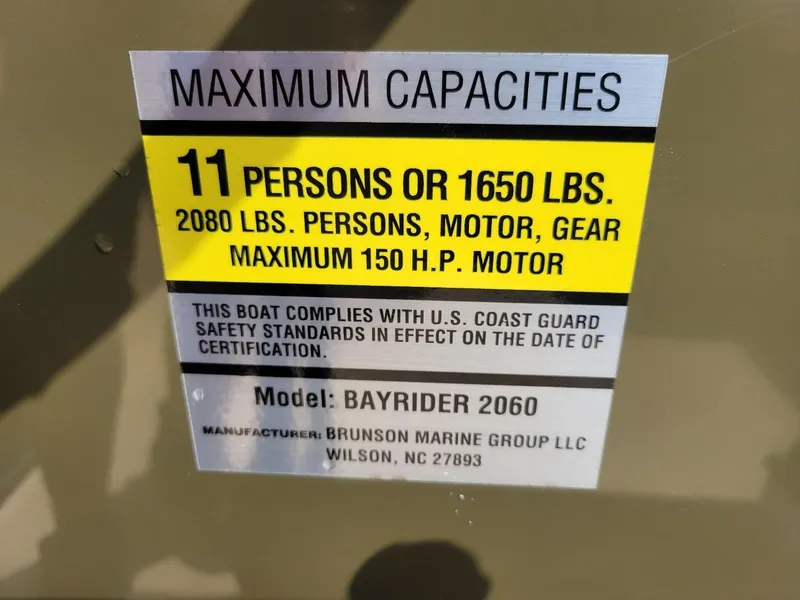 Slide: The Image of Capacity label for KenCraft Duck Rider 2060, 11 persons or 1650 lbs, max 150 HP motor. - 7