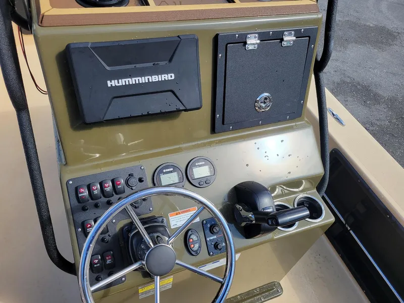 Slide: The Image of 2021 KenCraft Duck Rider 2060 center console with Humminbird electronics and Yamaha controls. - 8