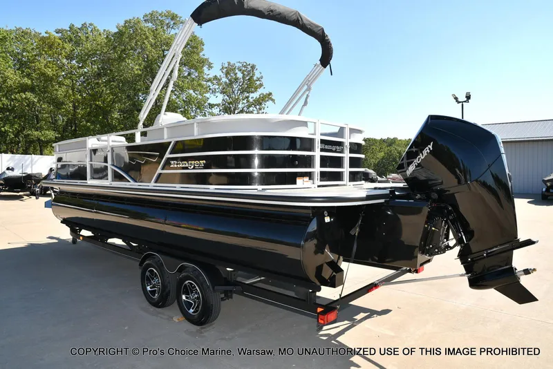 Slide: The Image of 2025 Ranger 243C Cruise pontoon boat with 250HP Mercury 4 Stroke engine, parked outdoors. - 16