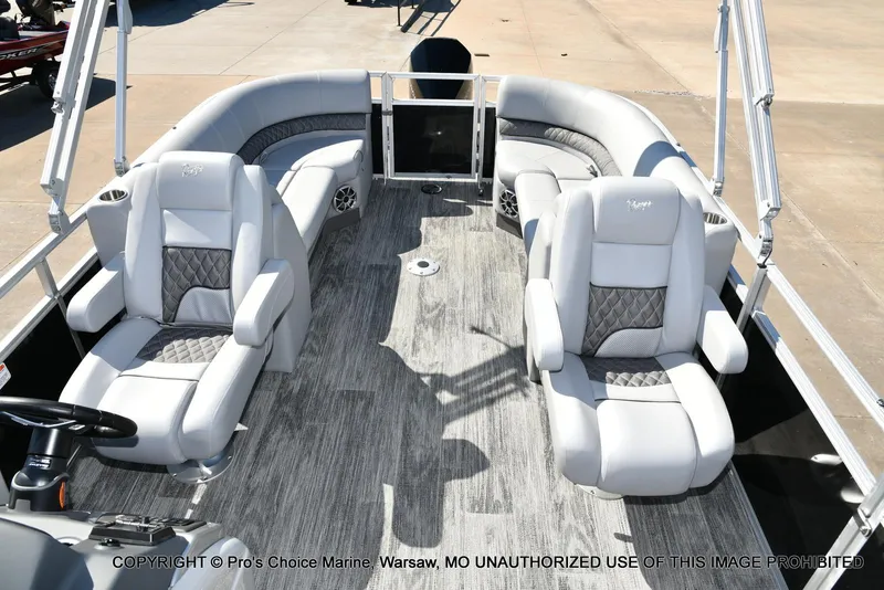 Slide: The Image of 2025 Ranger 243C Cruise boat interior with plush seating and modern design. - 22