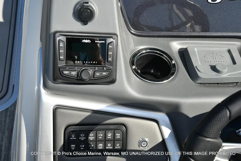 Slide: The Image of 2025 Ranger 243C Cruise dashboard with Wet Sounds audio system and control panel. - 28